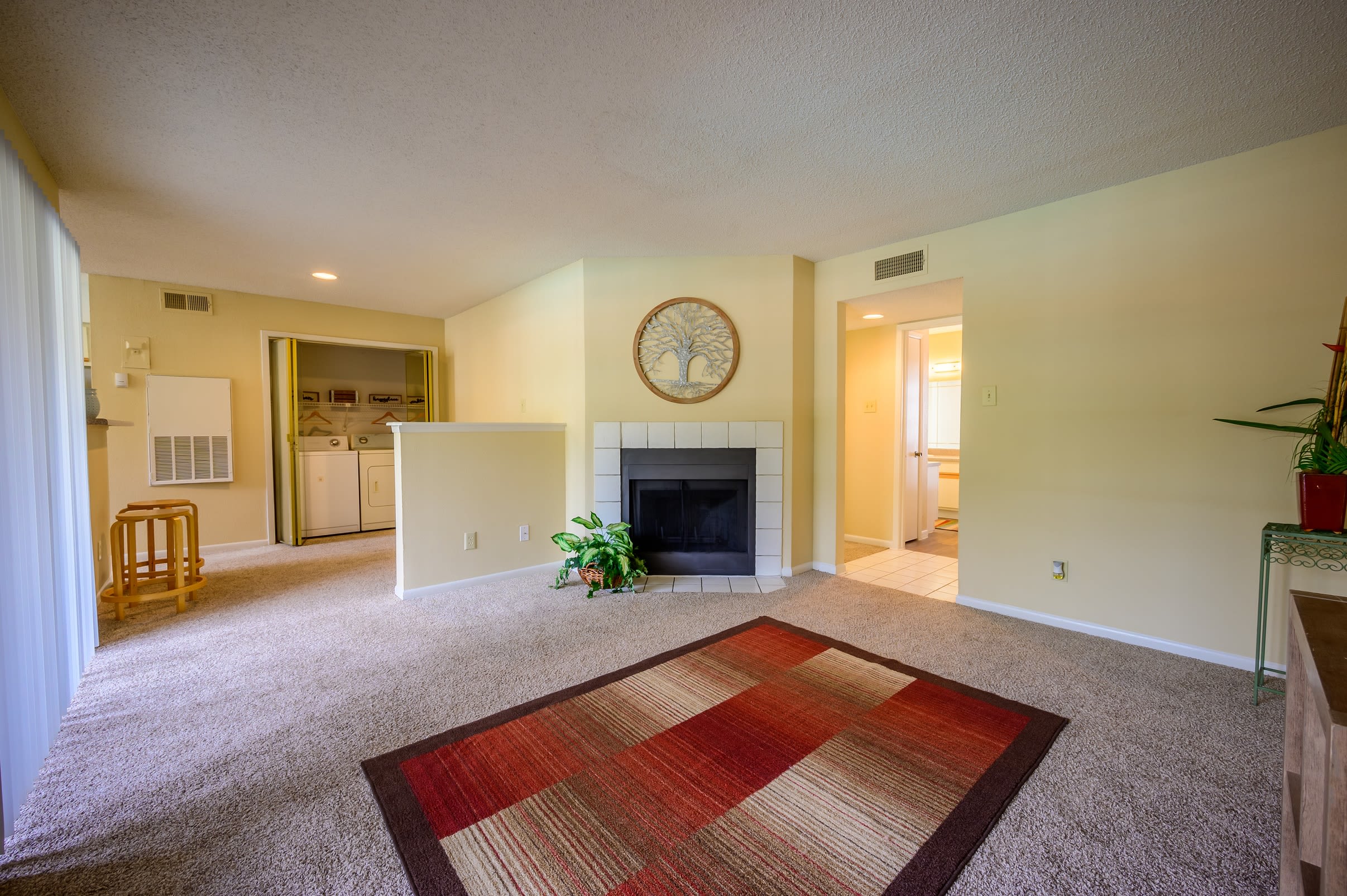 Large living room with a private balcony at Laurel Heights at Cityview in Fort Worth, Texas
