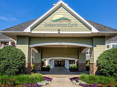 Covered front entrance to Greenwood Cove Apartments in Rochester, New York