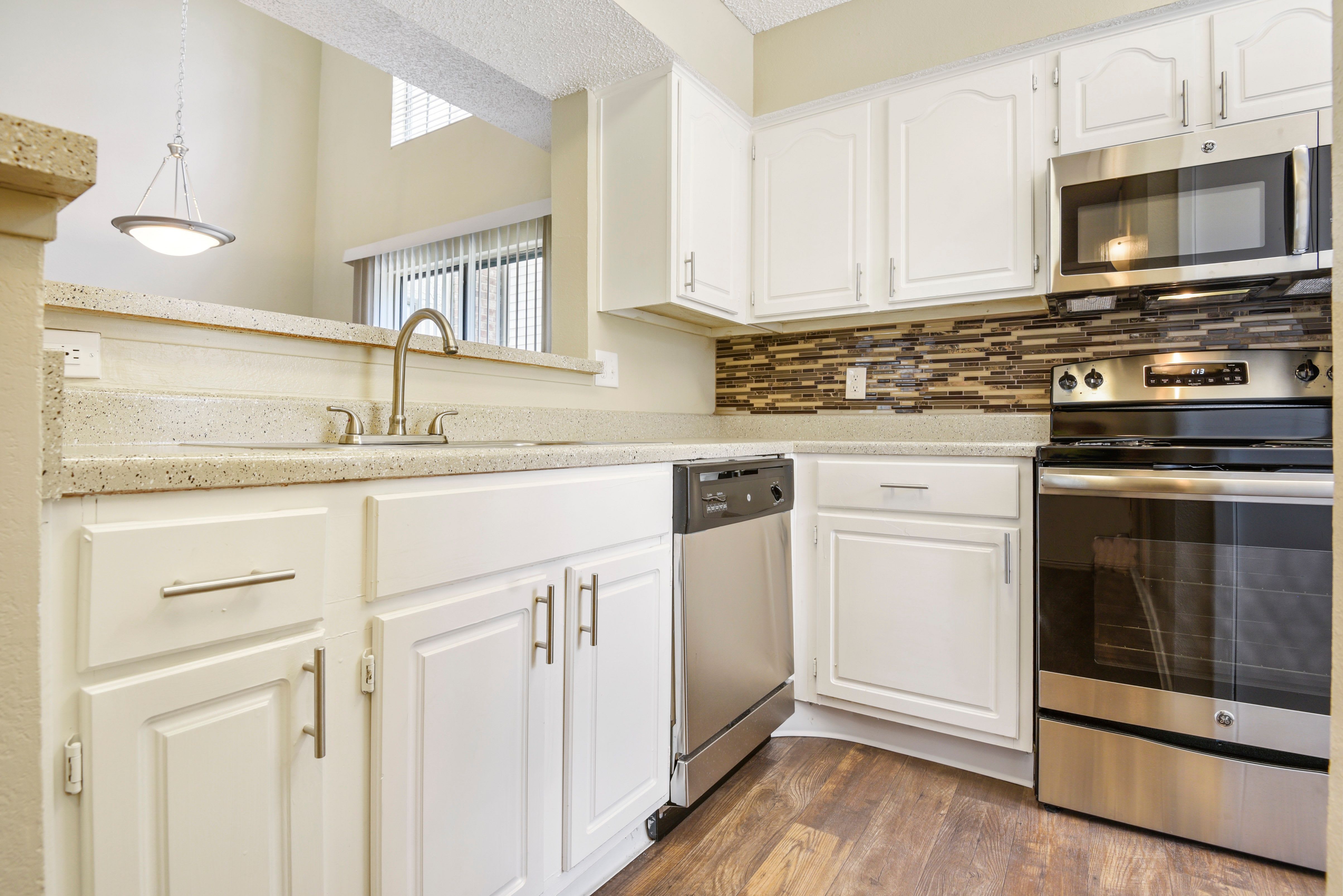 Stainless-steel appliances in kitchen at The Regent in Dallas, Texas