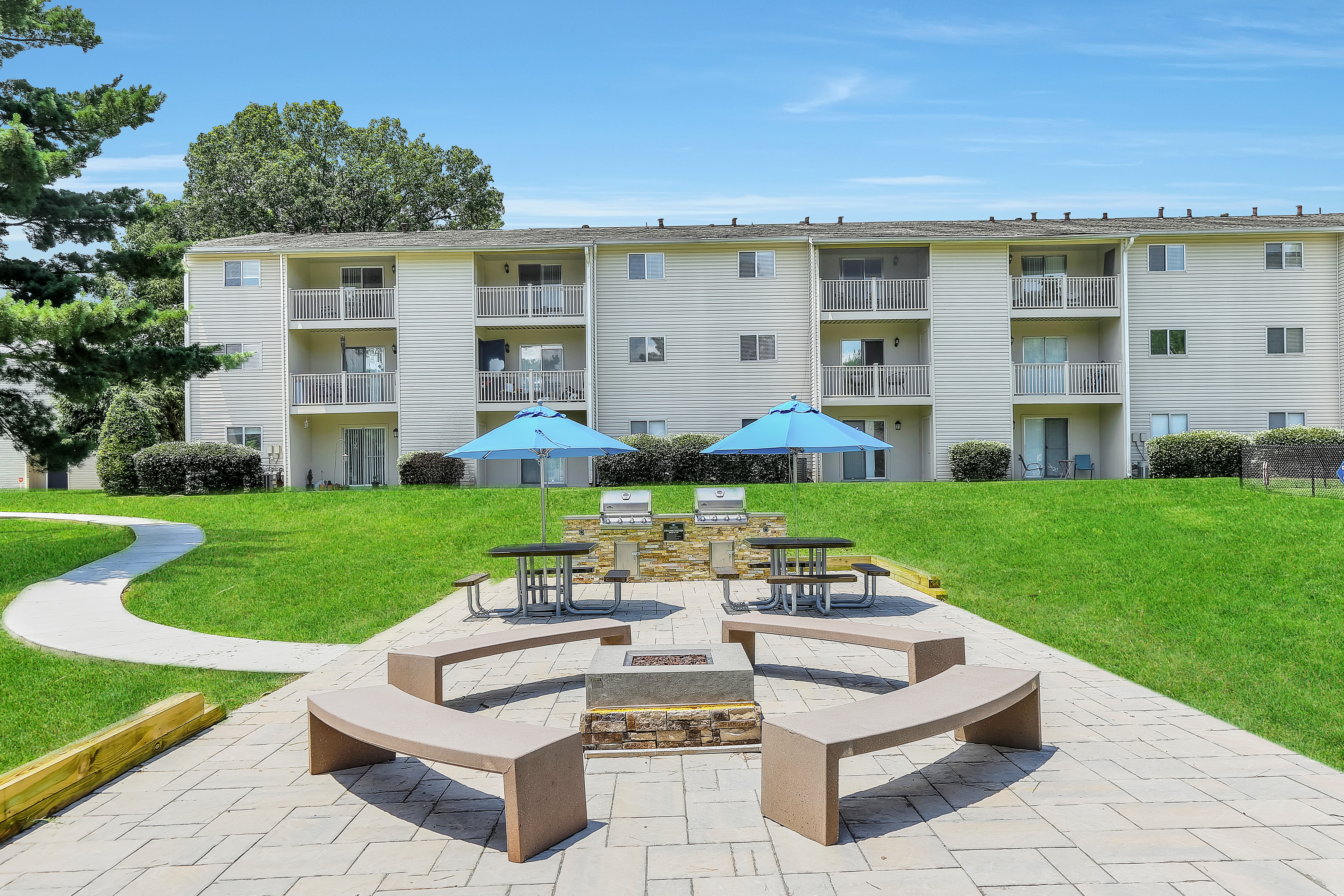 Firepit and patio with grilling stations at Lincoya Bay Apartments & Townhomes in Nashville, Tennessee