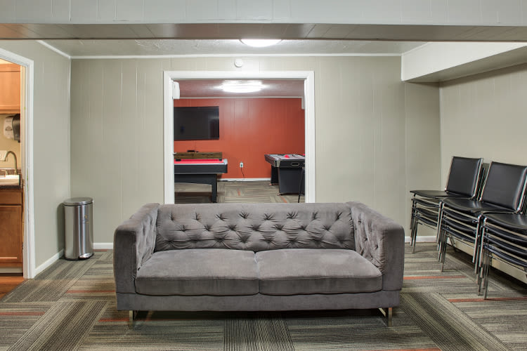 View of living room from modern kitchen at Solon Club Apartments