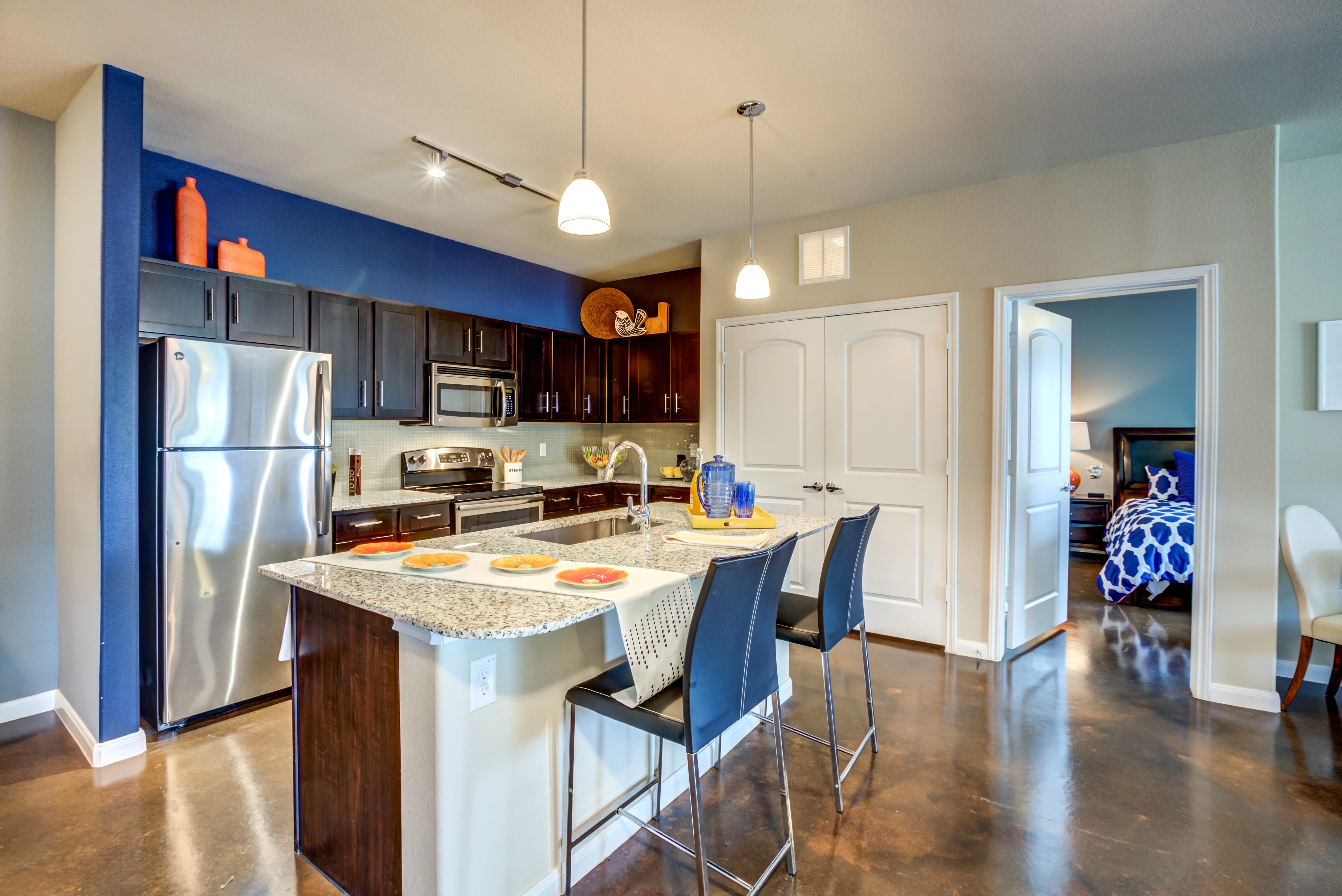 Gorgeous open kitchen with hardwood flooring at Legacy Brooks in San Antonio, Texas