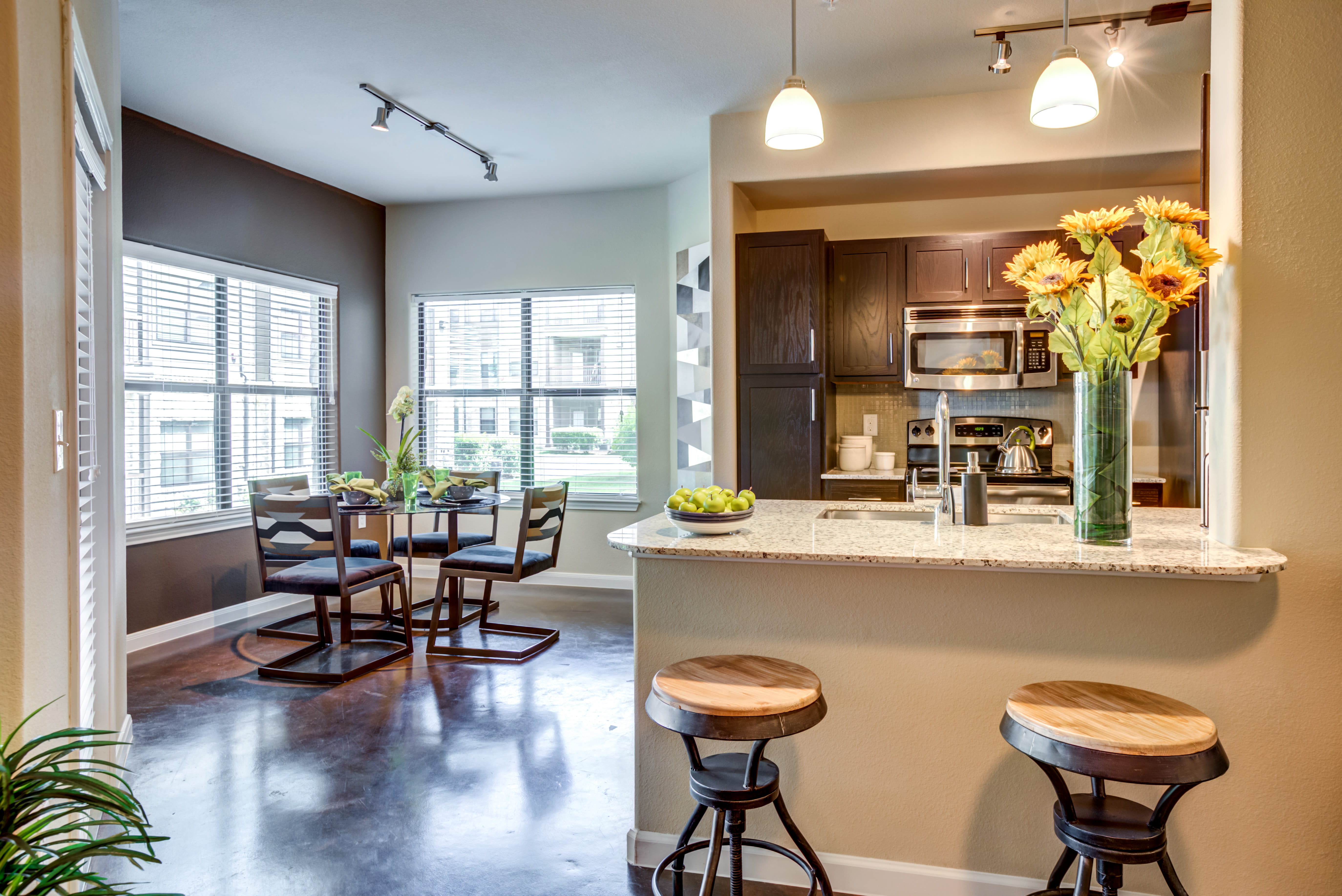 Dining room and Kitchen with barstools at Legacy Brooks in San Antonio, Texas