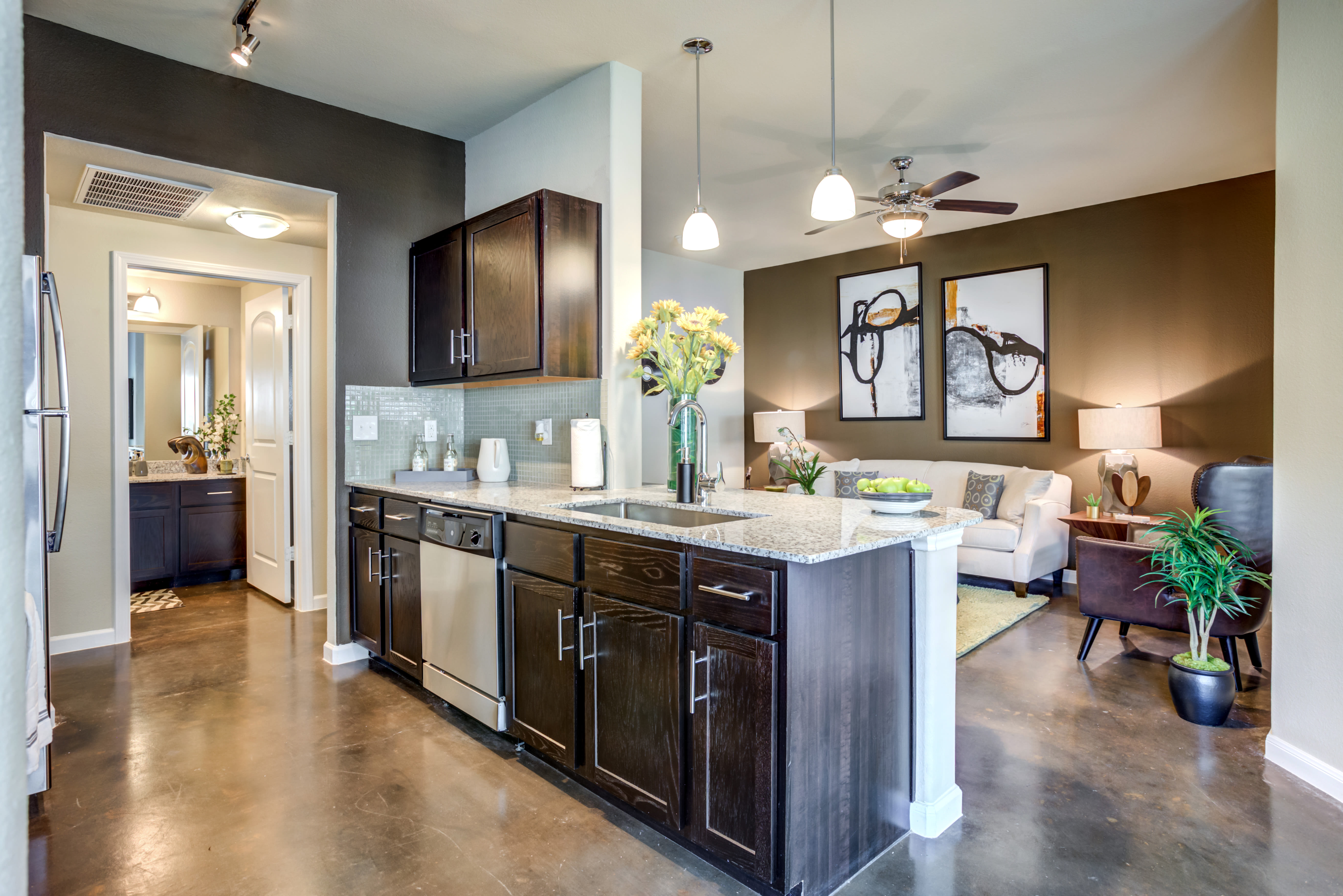 Model kitchen overlooking living room at Legacy Brooks in San Antonio, Texas