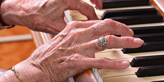 A resident playing the piano at Anchor Bay at Greenwich in East Greenwich, Rhode Island.