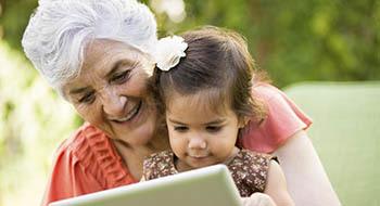 Woman reading to child at The Pearl at Fort Mill in Fort Mill, South Carolina