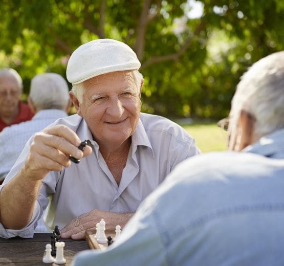 Man playing chess at Reunion Court of The Woodlands in The Woodlands, Texas