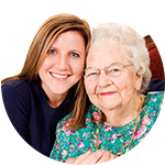 A caretaker with senior resident at The Springs