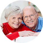 A resident and caregiver laugh together at The Springs in San Angelo
