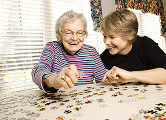 Woman doing a puzzle at The Springs in San Angelo
