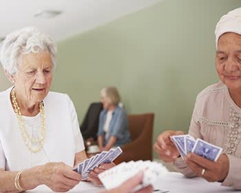 Woman playing cards at The Phoenix at Albany