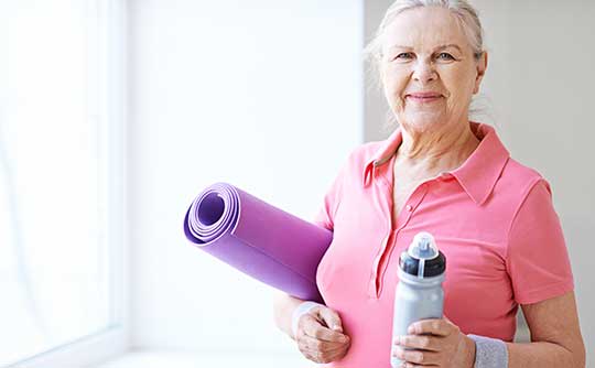 A resident of West Fork Village ready for her yoga class in Irving, Texas