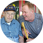 Caretaker having a conversation with a senior living resident at Parkview on Hollybrook