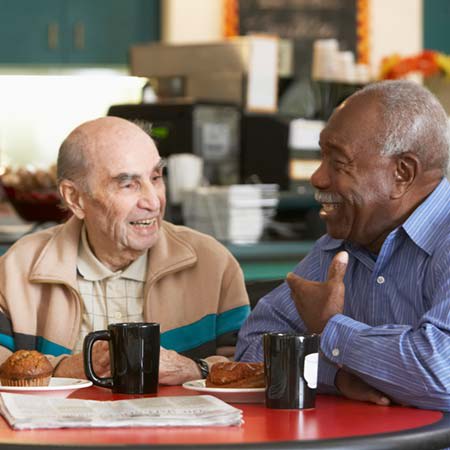 Enjoying coffee with a friend at The Legacy at Southpointe Drive in Greenville, South Carolina