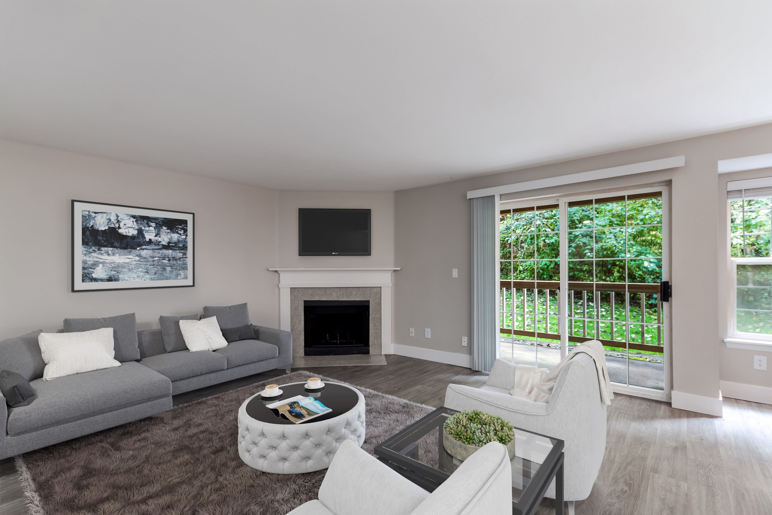 Fireplace and hardwood floors in model apartment home at Chandlers Bay