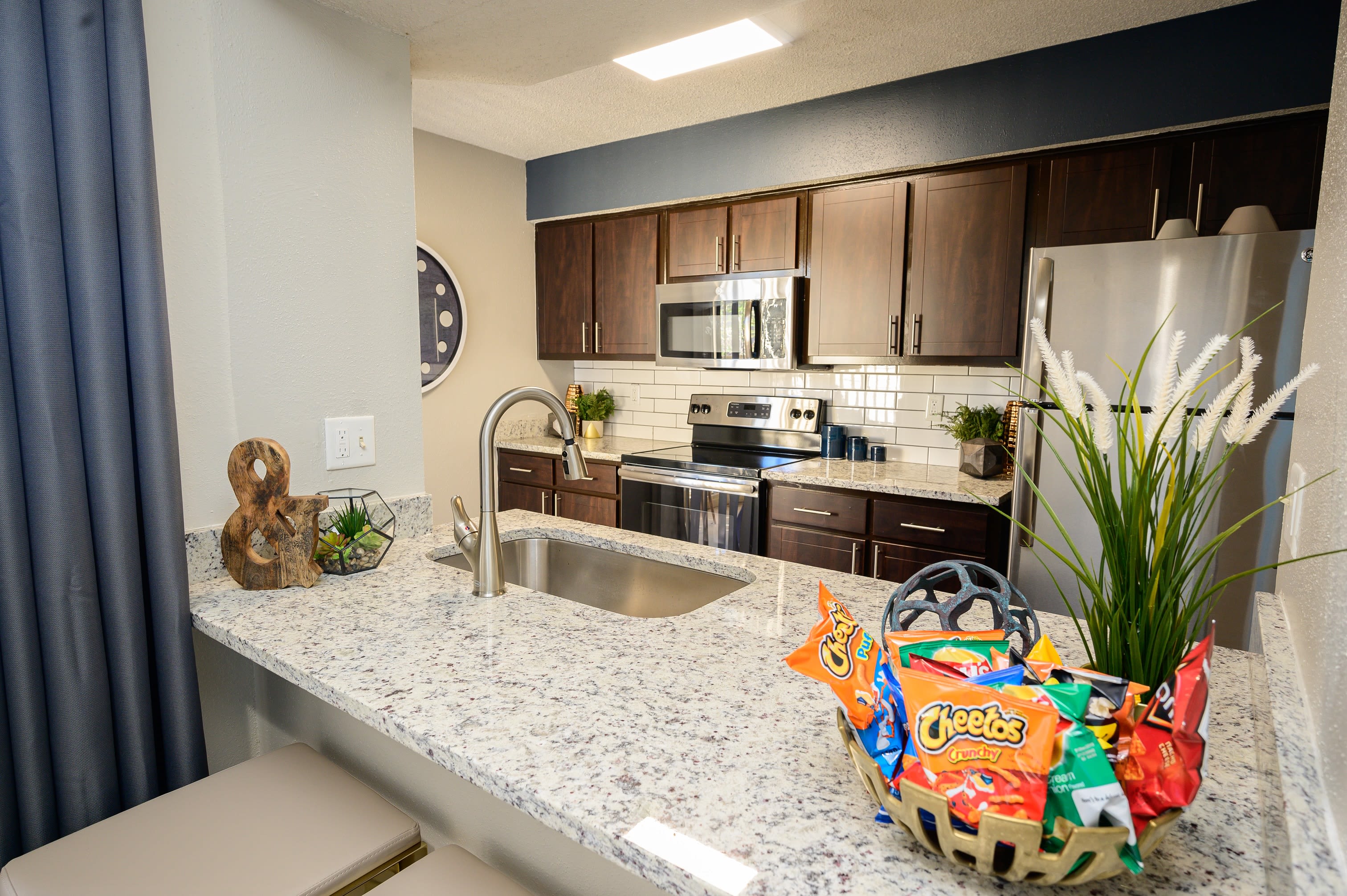 Spacious kitchen with plenty of counter space and wood-style cabinets at Laurel Heights at Cityview in Fort Worth, Texas