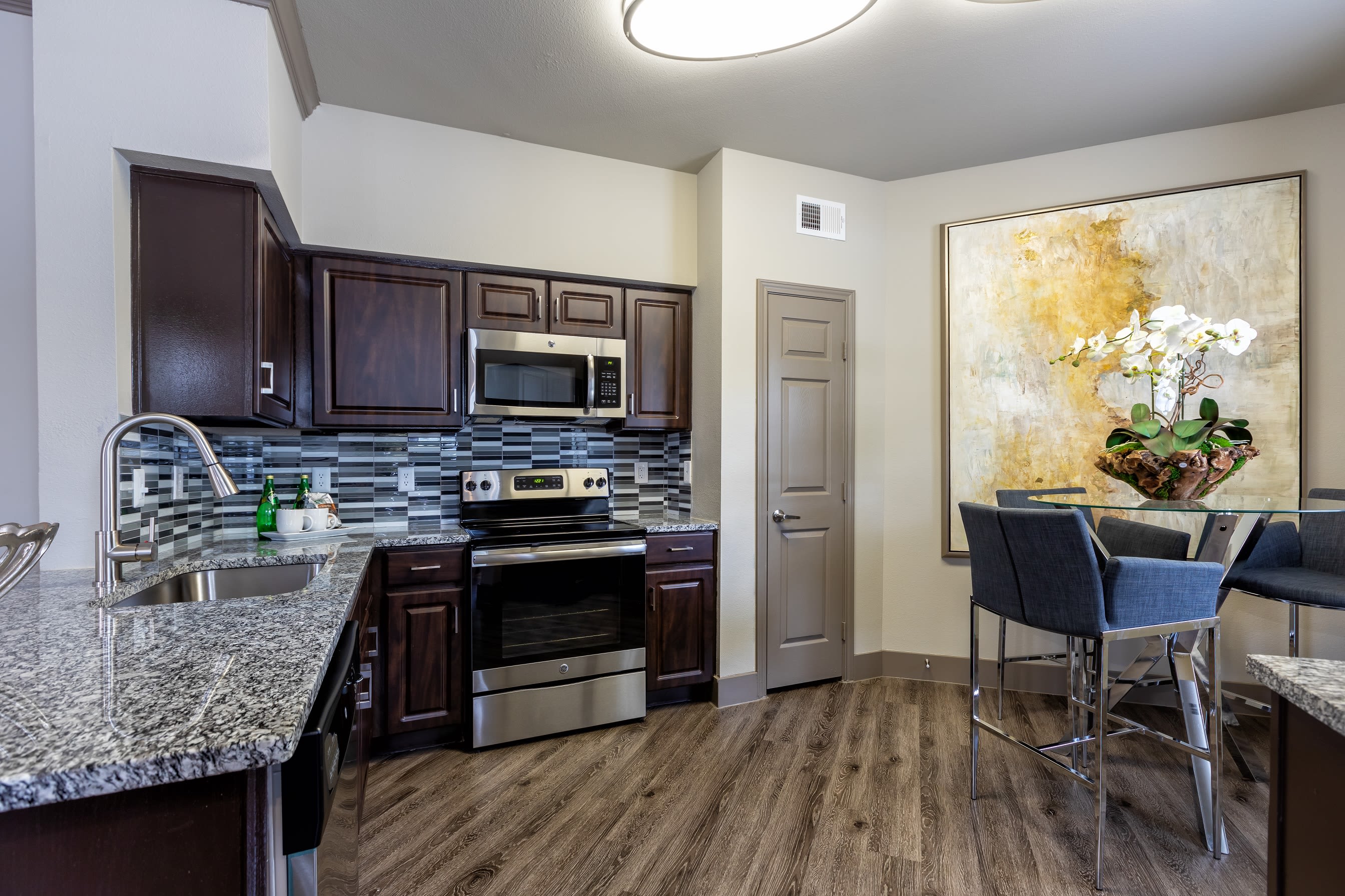 Open-concept layout with hardwood floors at Artisan at Lake Wyndemere in The Woodlands, Texas