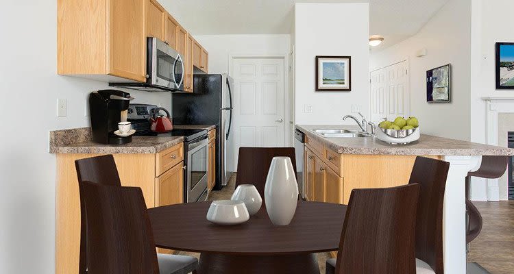 Upgraded kitchen and dining room view at Avon Commons in Avon, New York