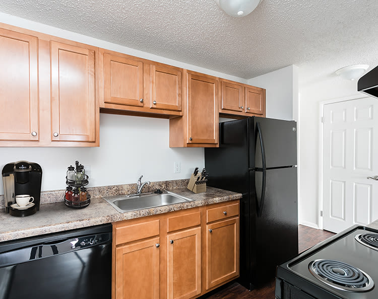 Well-equipped kitchen at Hilton Village II in Hilton, New York