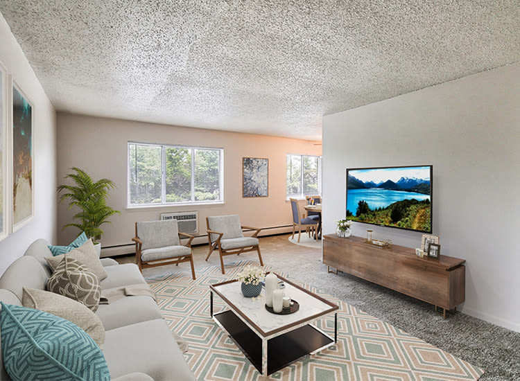 Well decorated living room at Knollwood Manor Apartments in Fairport, New York