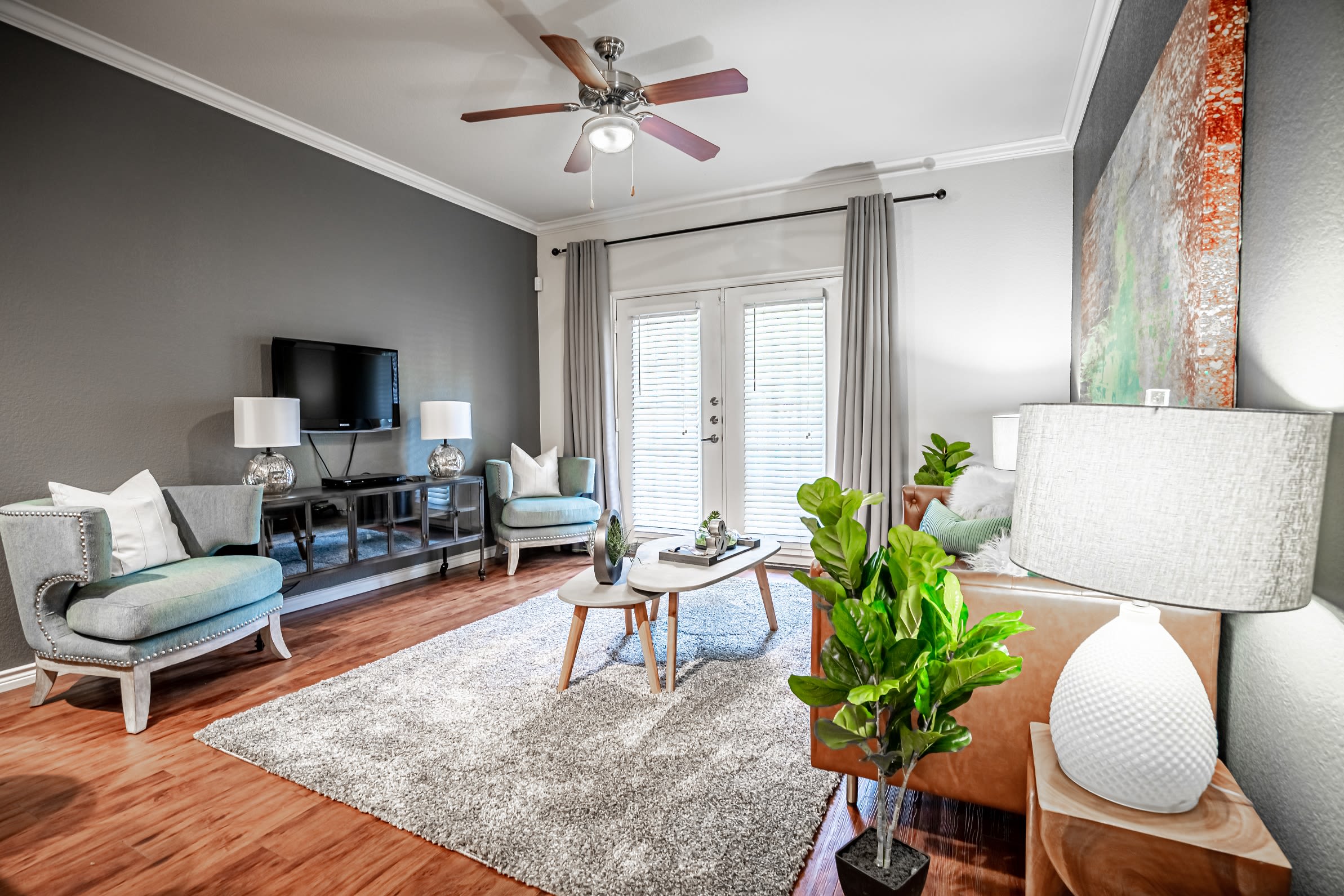Open-concept layout with hardwood floors at The Asten at Ribelin Ranch in Austin, Texas
