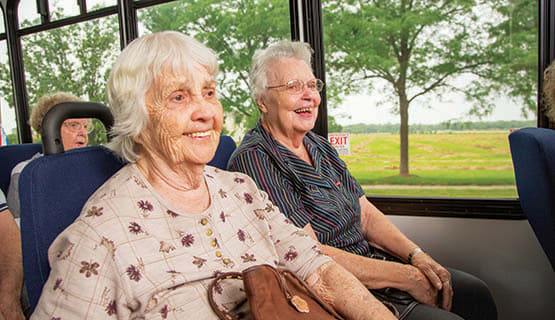 Residents of The Heritage at Fountain Point in Norfolk, Nebraska on the community bus