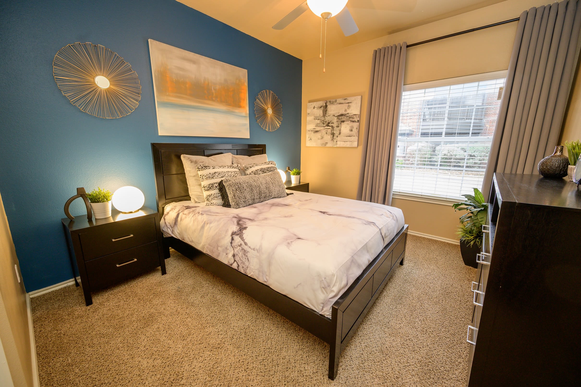 Well-decorated bedroom in model home at Alon at Castle Hills in San Antonio, Texas