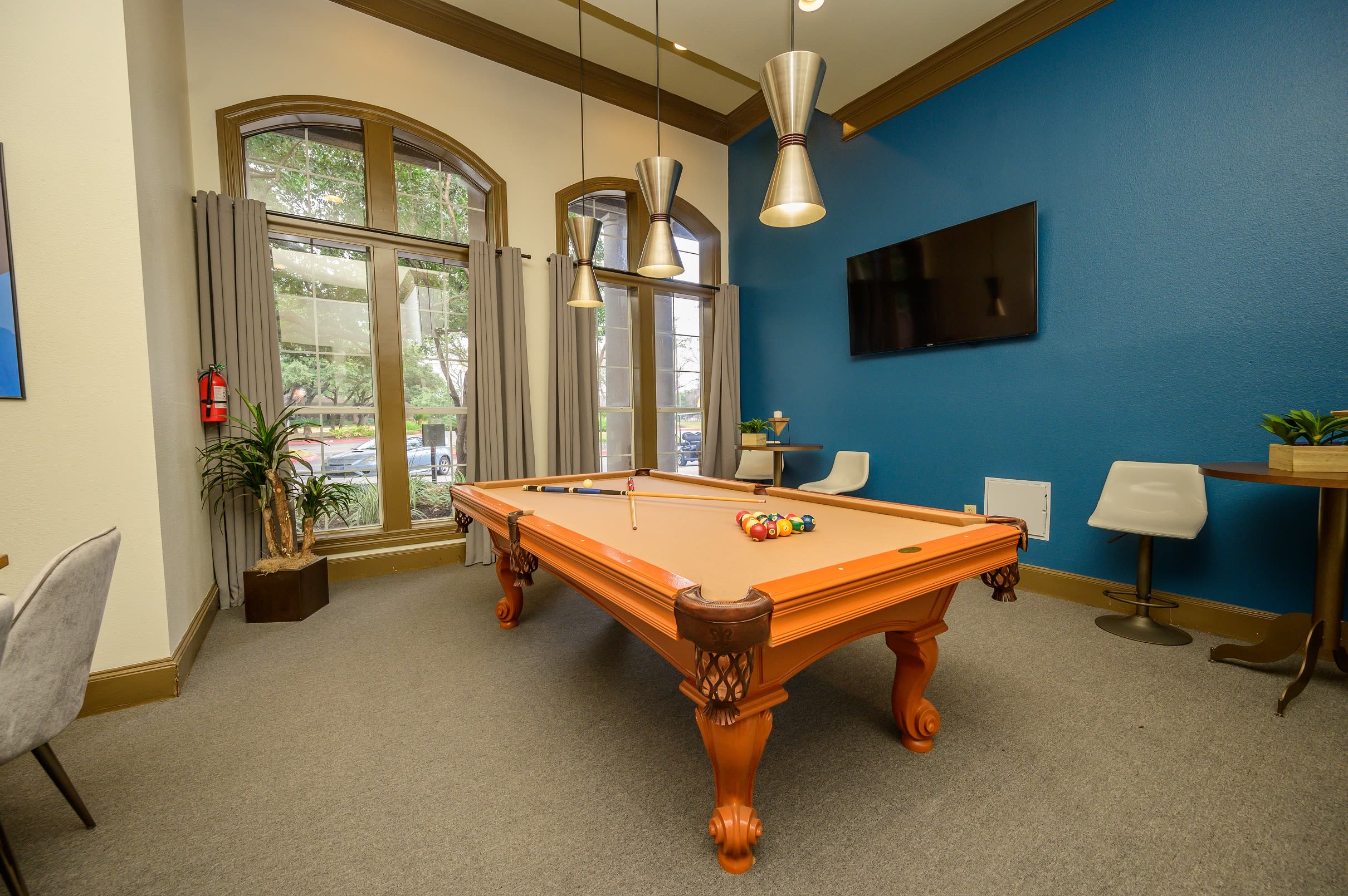 Resident clubhouse with billiards table and more at Alon at Castle Hills in San Antonio, Texas