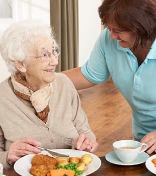 Resident talking to a caretaker at Cherry Park Plaza in Troutdale, Oregon