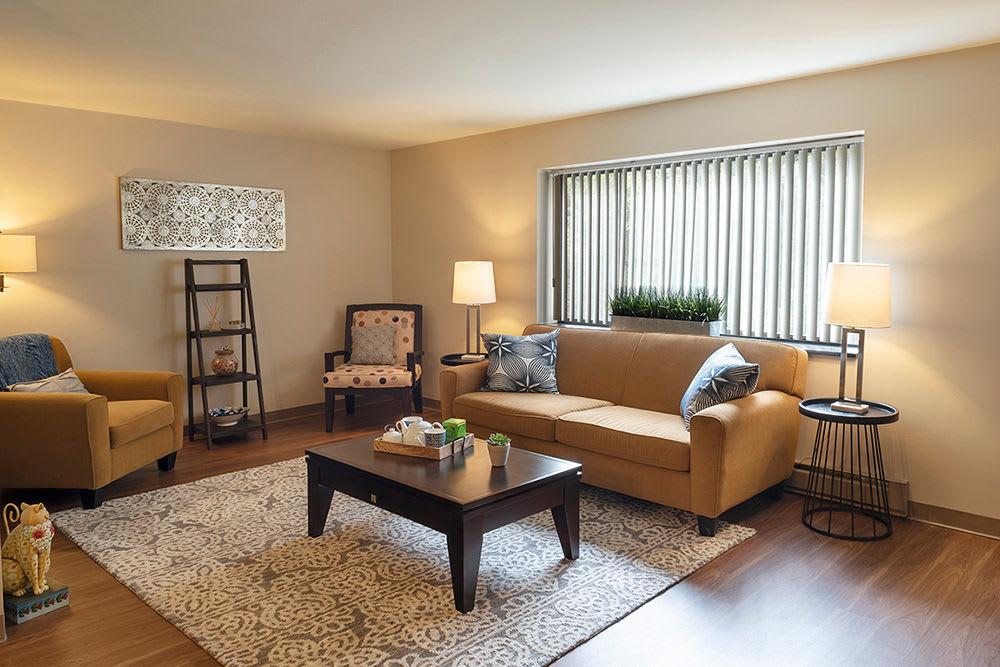 Cozy living room at Maiden Bridge & Canongate Apartments in Pittsburgh, Pennsylvania