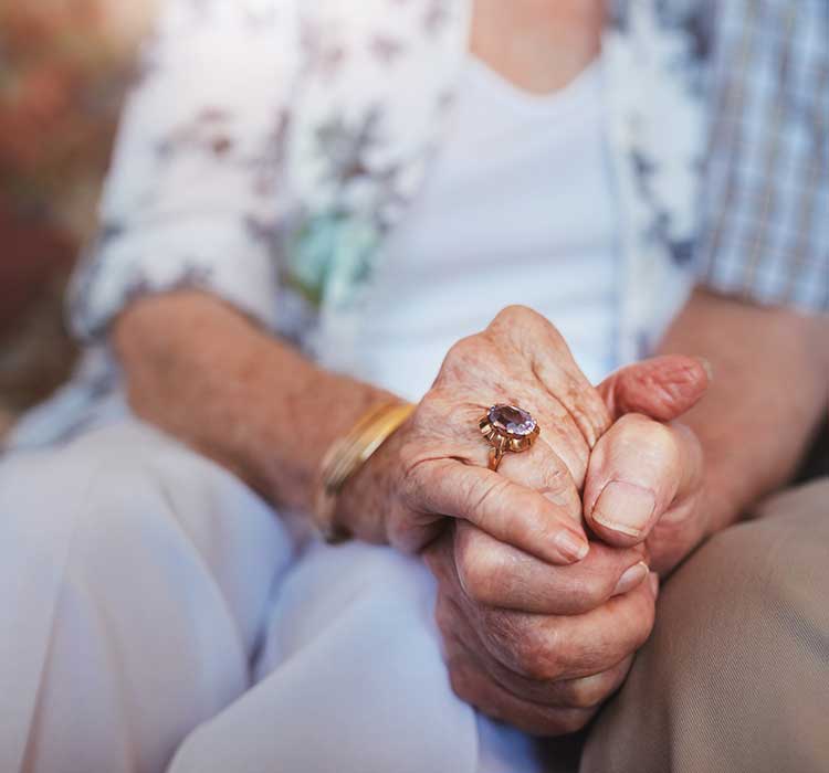 Residents holding hands in the community at The Lakes of Paducah in Paducah, Kentucky