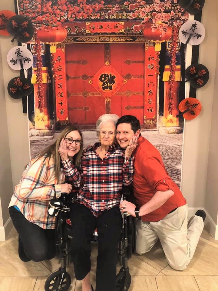 Resident with visitors at Inspired Living Lewisville in Lewisville, Texas. 