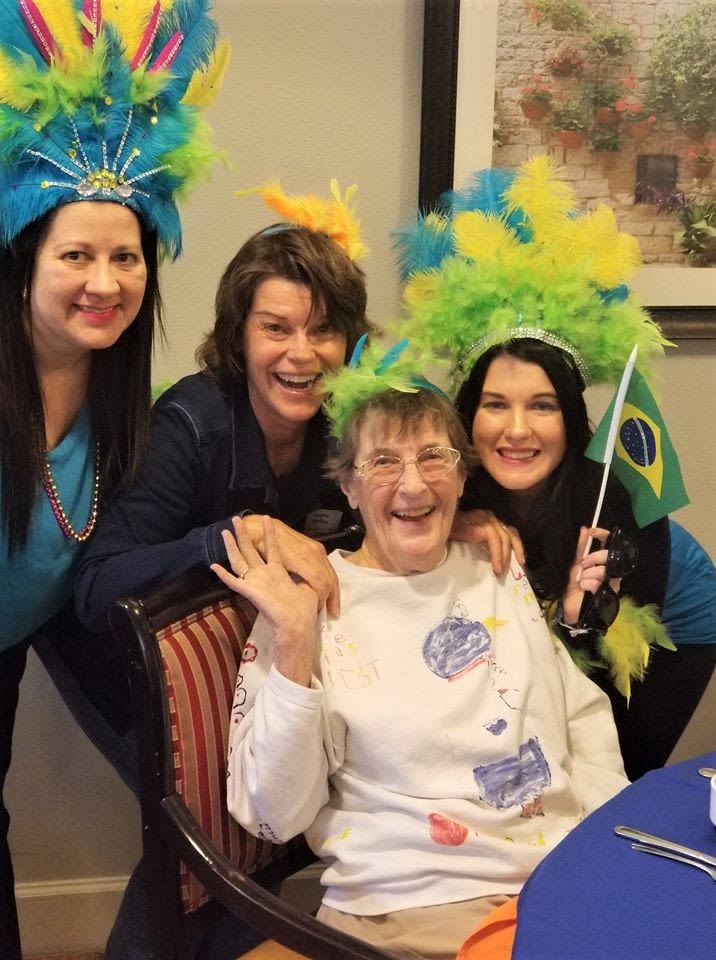 Staff and resident celebrating Brazil at Inspired Living in Bradenton, Florida.