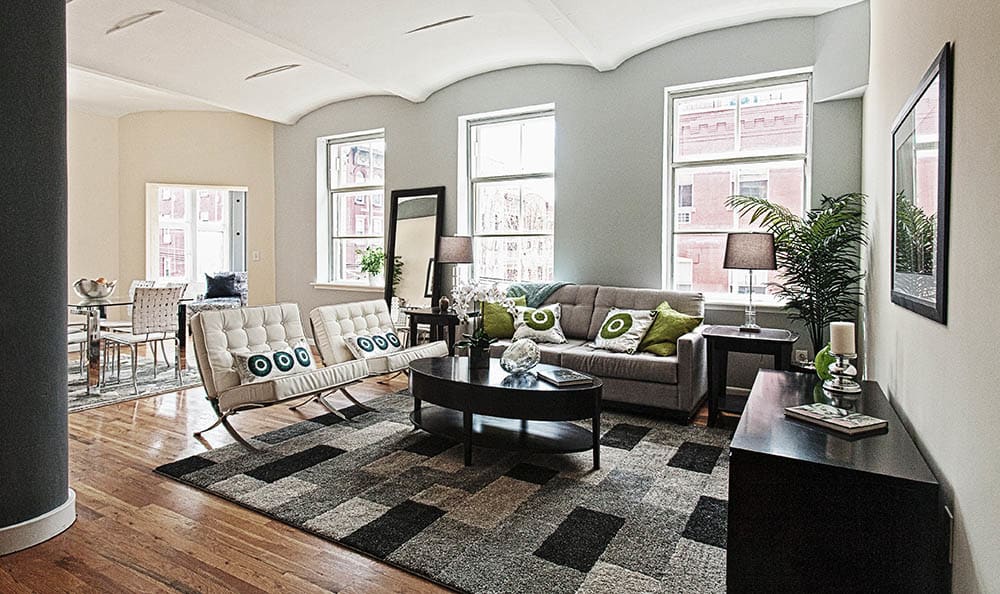 Living room with wood-style flooring at Grand Adams in Hoboken, New Jersey