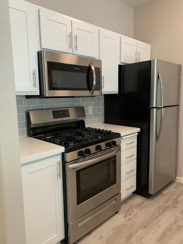 Beautiful modern kitchen with stainless steel appliances at Laguna Creek Apartments in Elk Grove, California