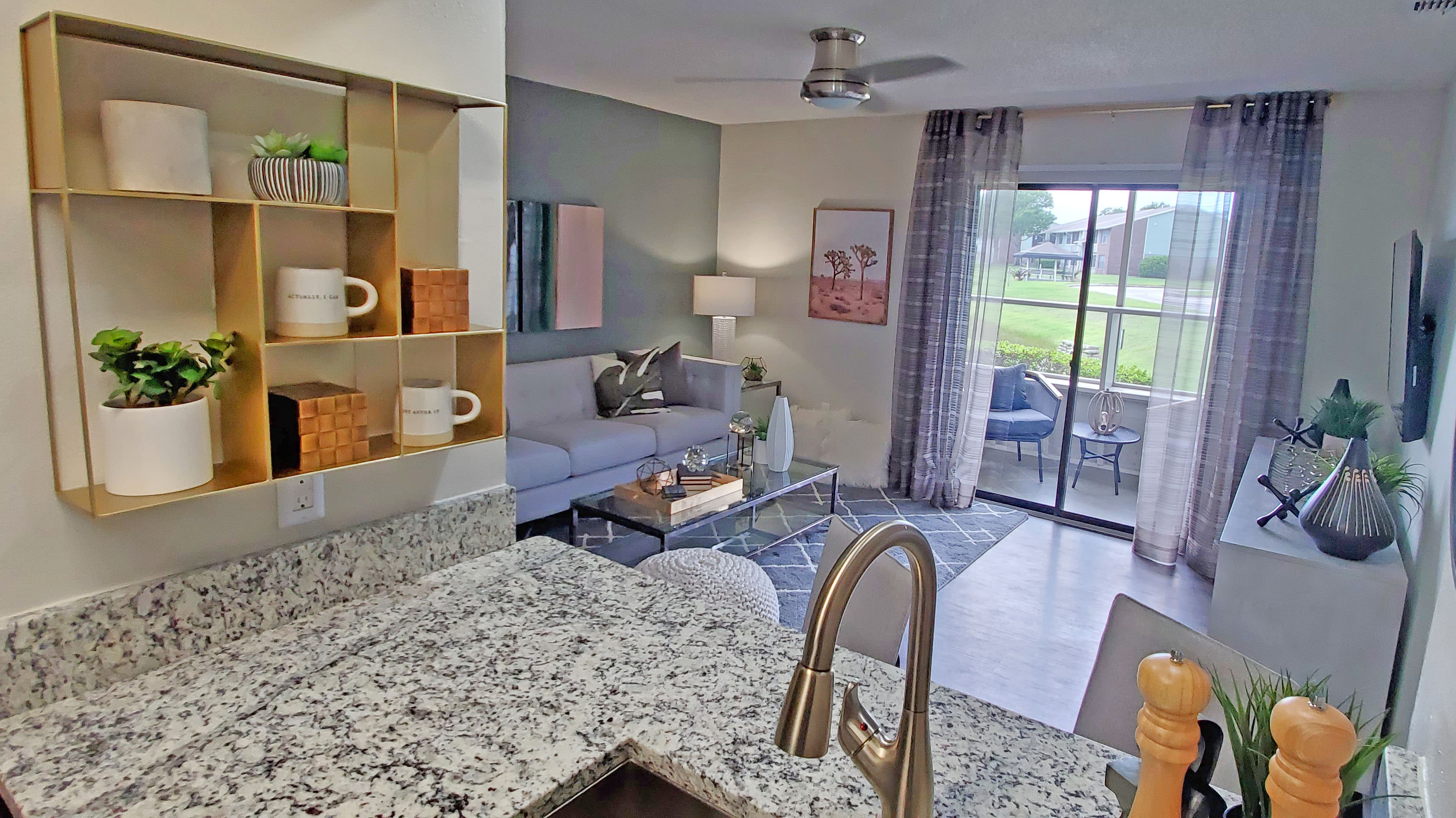 Kitchen with a stainless-steel sink at Compass in Melbourne, Florida