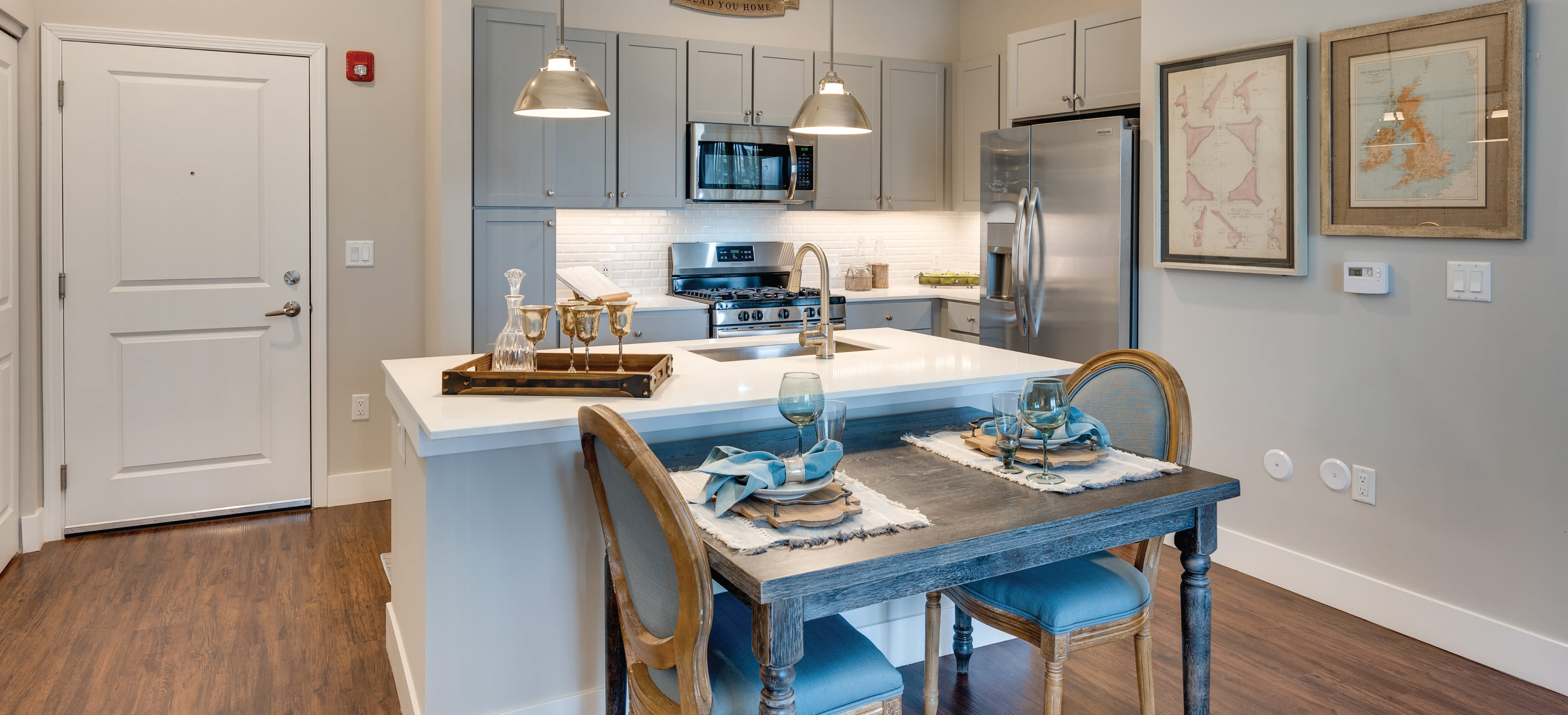 Modern kitchen and entrance - Avenida Naperville Apartments