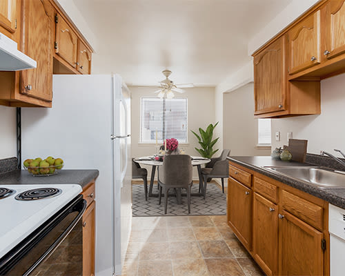 Bright, fully-equipped kitchen at East Ridge Manor Apartments in Rochester, New York