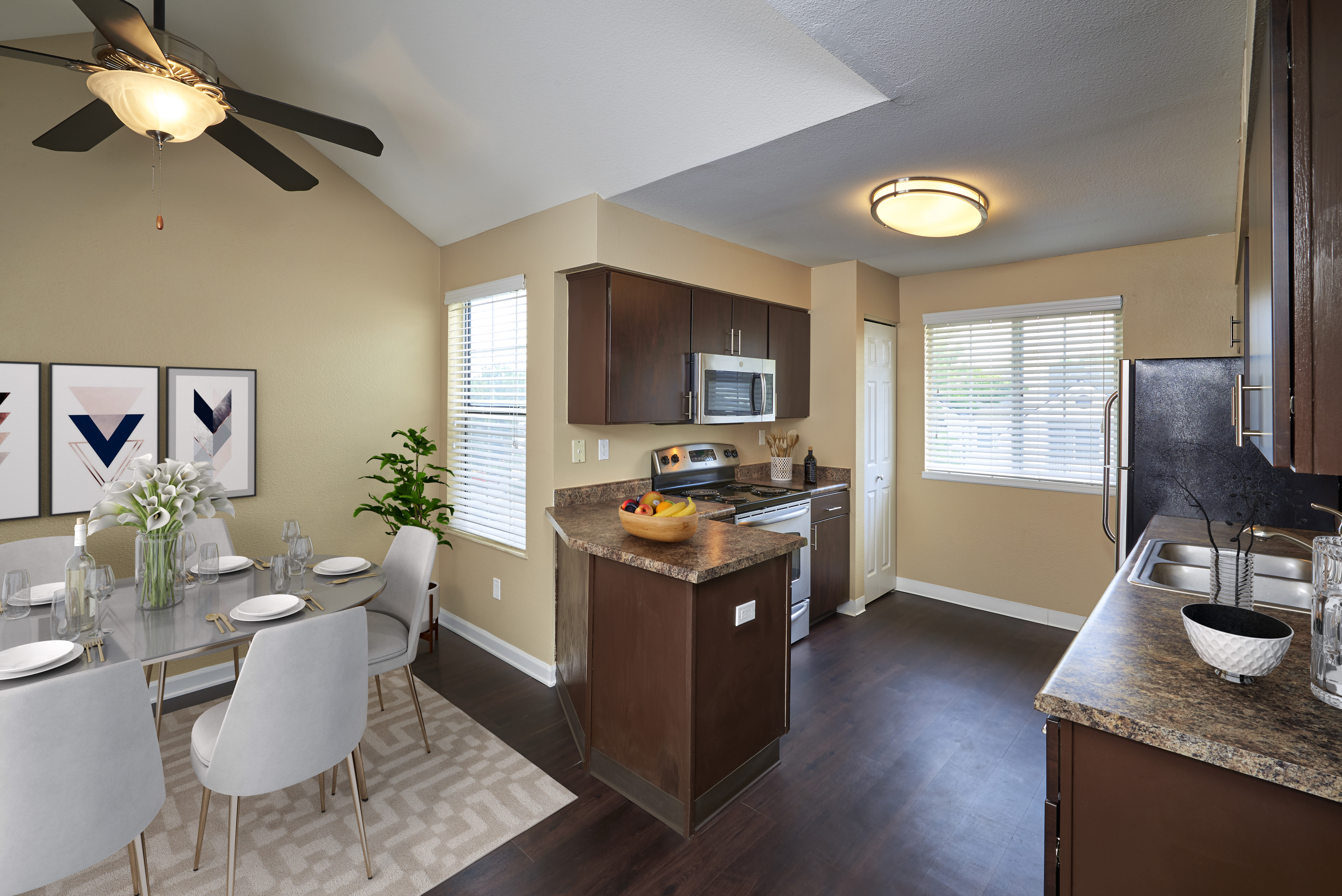Open kitchen with separate dining room at Villas at Homestead Apartments in Englewood, Colorado