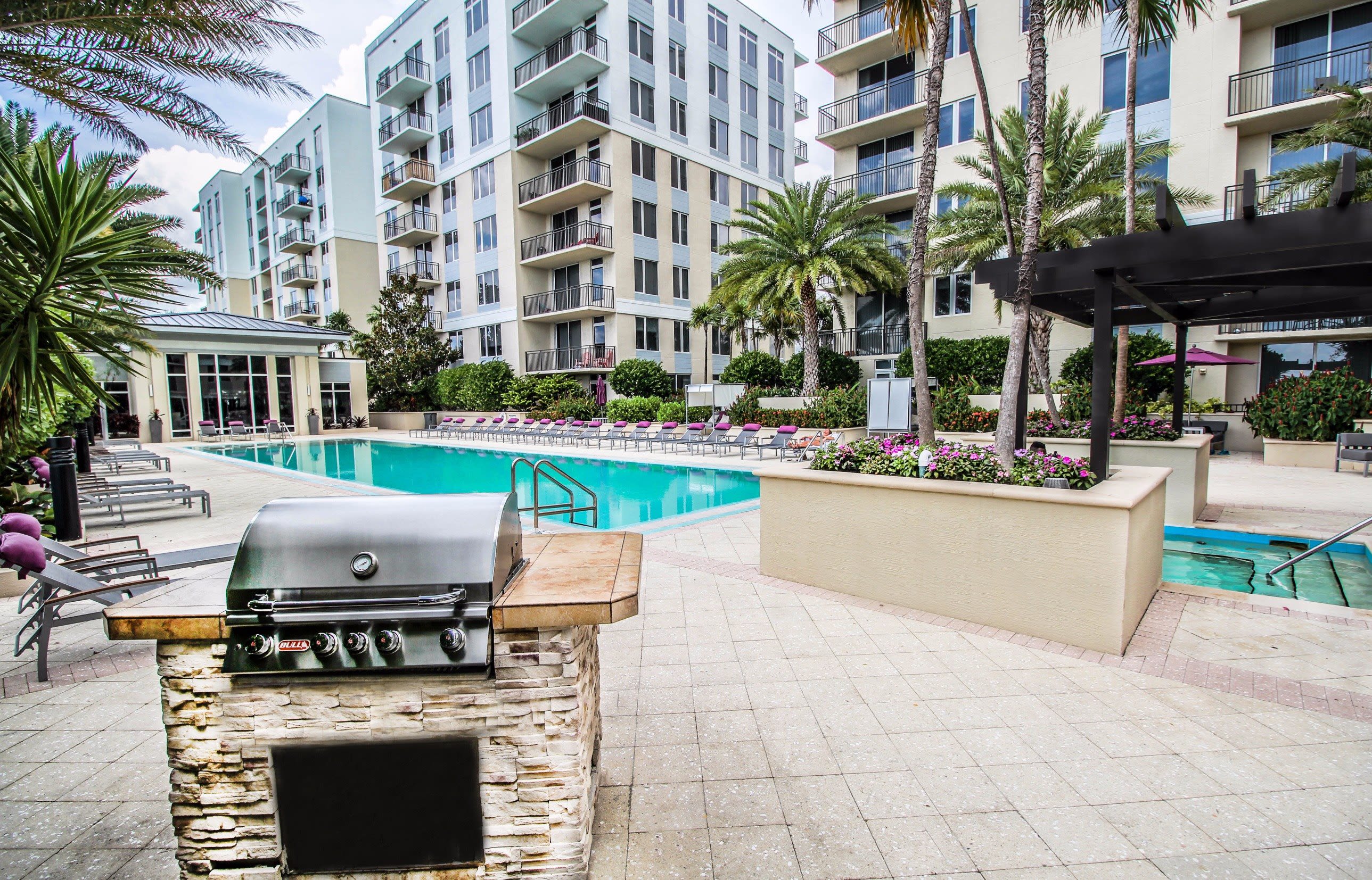 Beautiful hot tub underneath a wooden pergola at Midtown 24 in Plantation, Florida