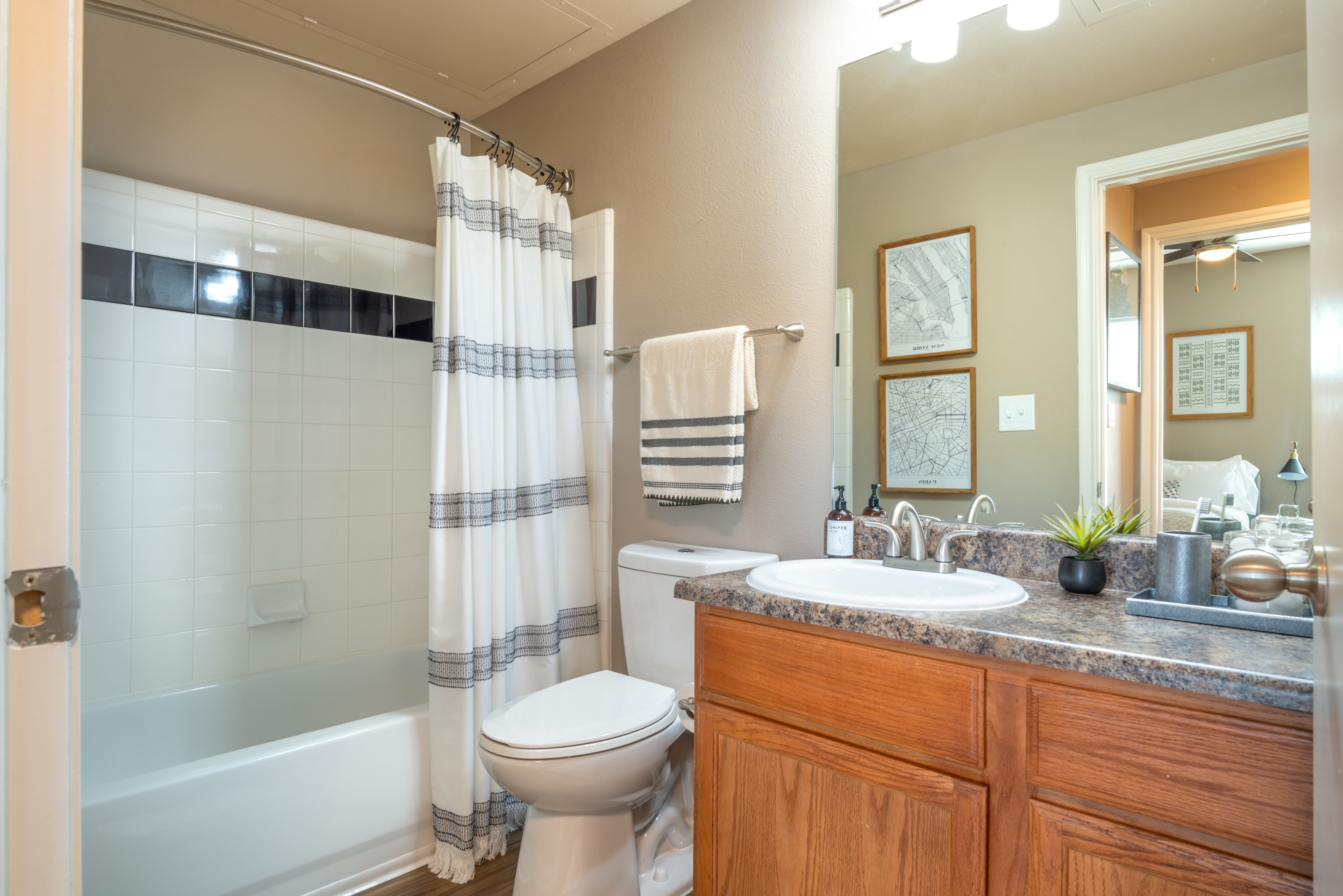 Granite countertop in a model apartment's bathroom at Olympus Team Ranch in Benbrook, Texas