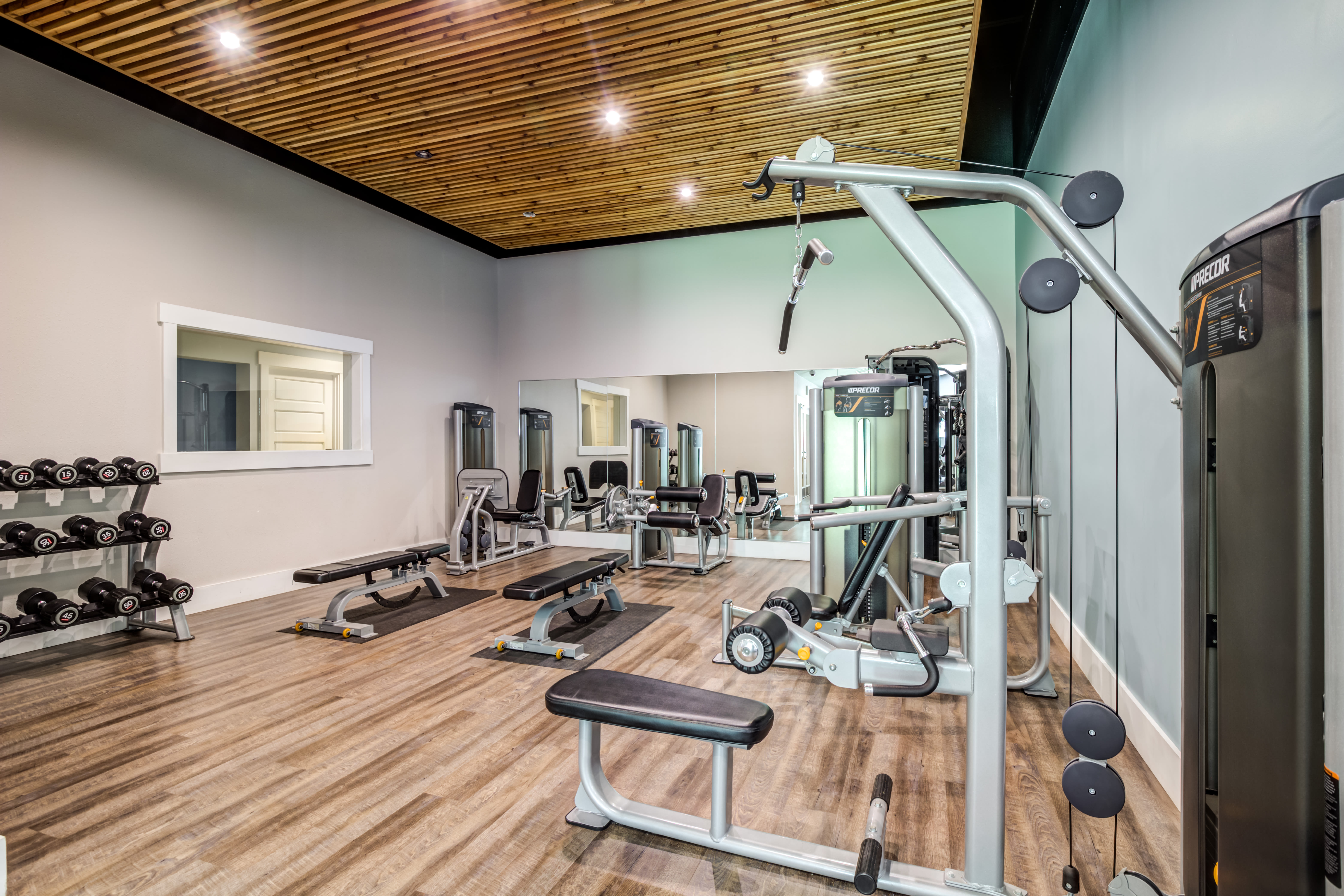 A fully equipped fitness center at The Preserve at Forbes Creek in Kirkland, Washington