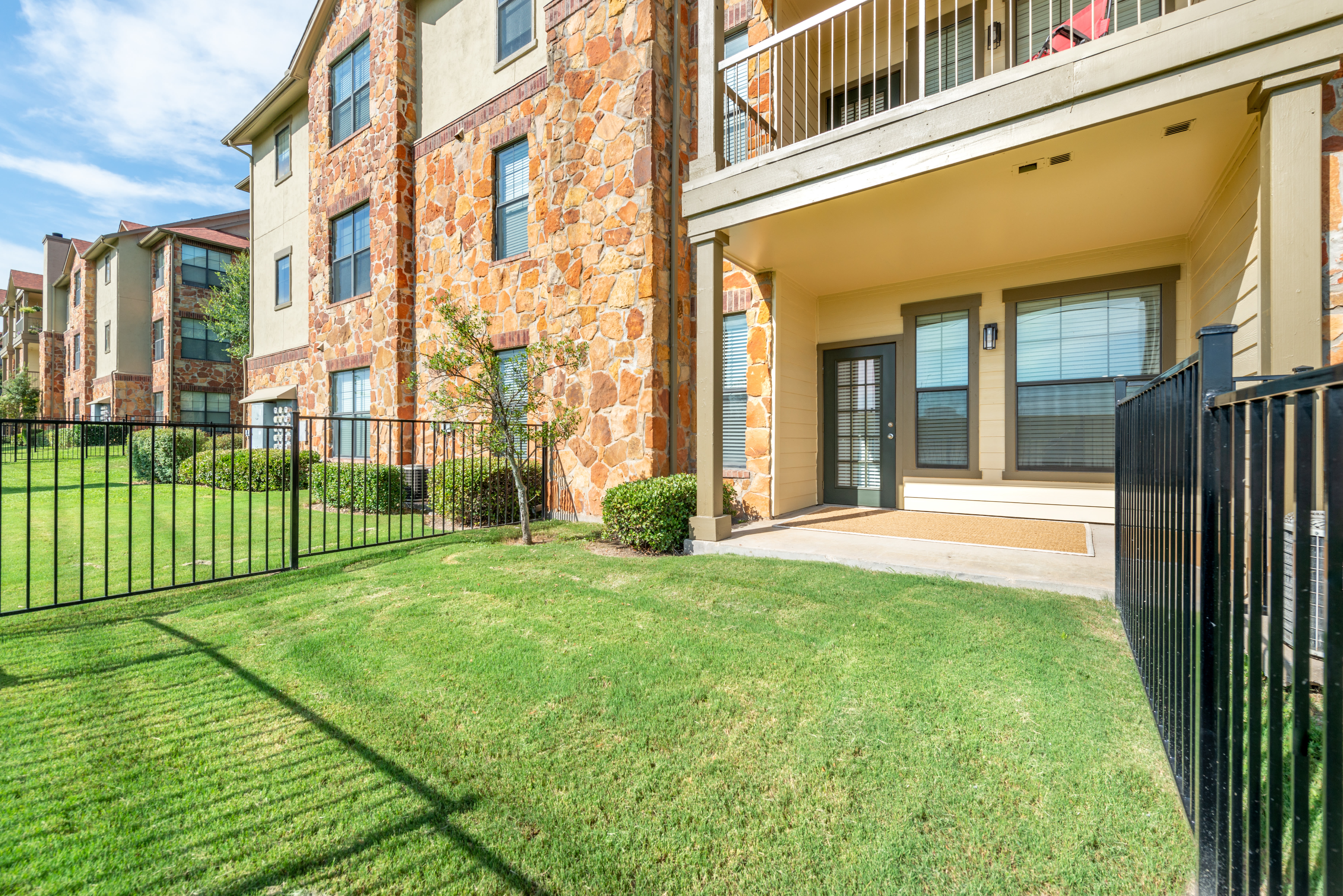 Green grass throughout the community at Olympus Team Ranch in Benbrook, Texas