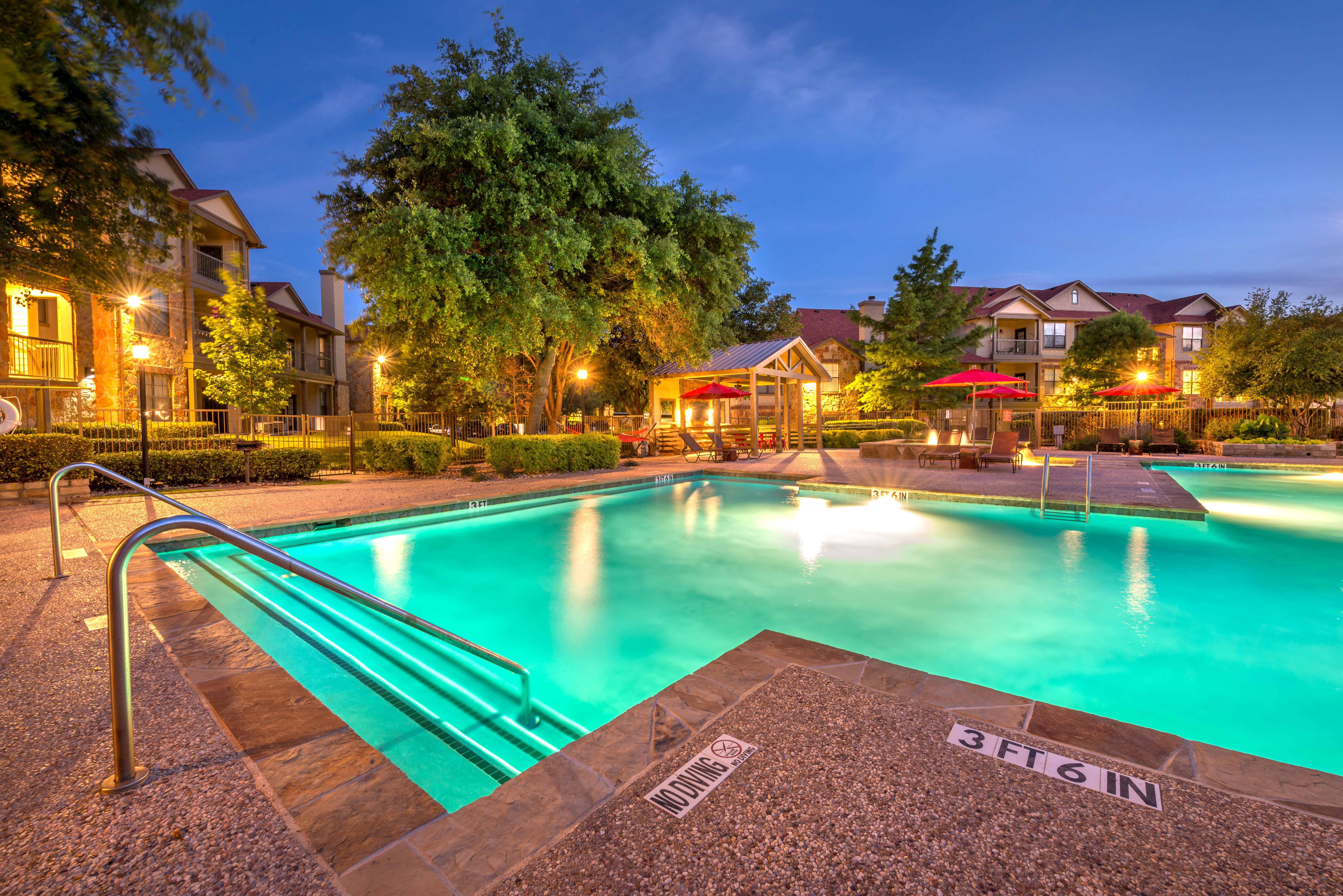 Resort-style swimming pool at Olympus Team Ranch in Benbrook, Texas