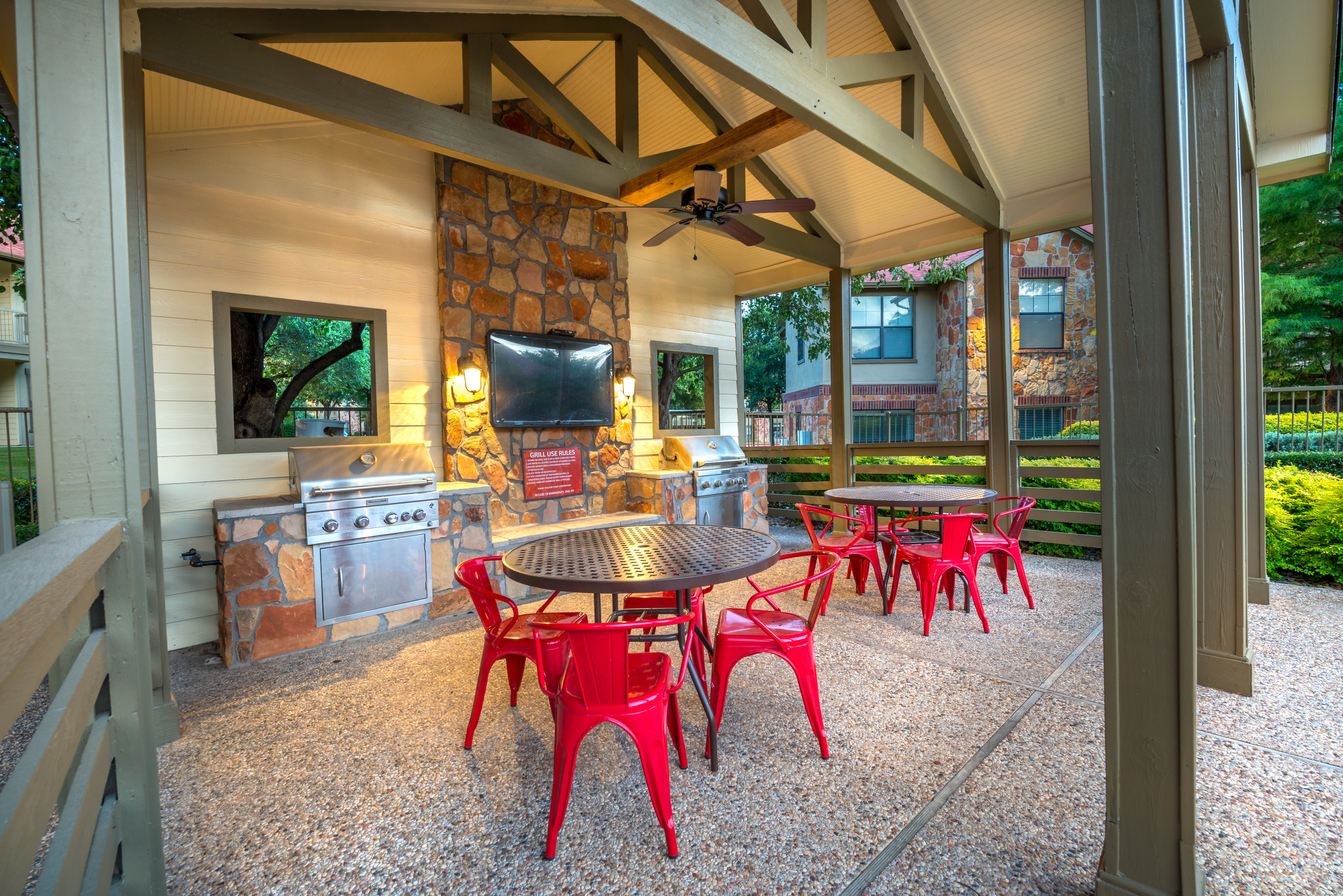 Lounge area in front of the fireplace in the clubhouse at Olympus Team Ranch in Benbrook, Texas