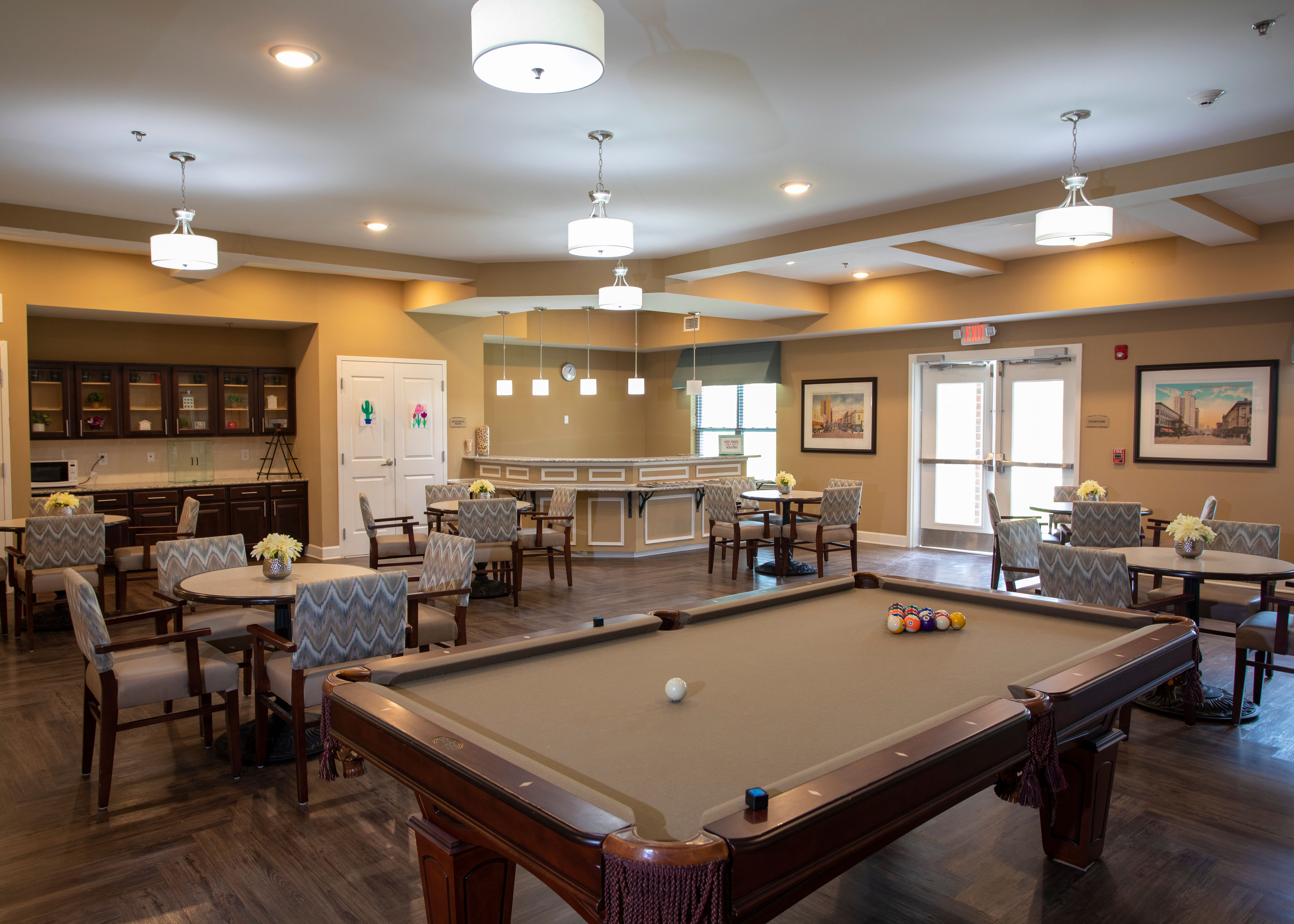 A clubhouse featuring a pool table and lots of seating area at The Harmony Collection at Columbia in Columbia, South Carolina