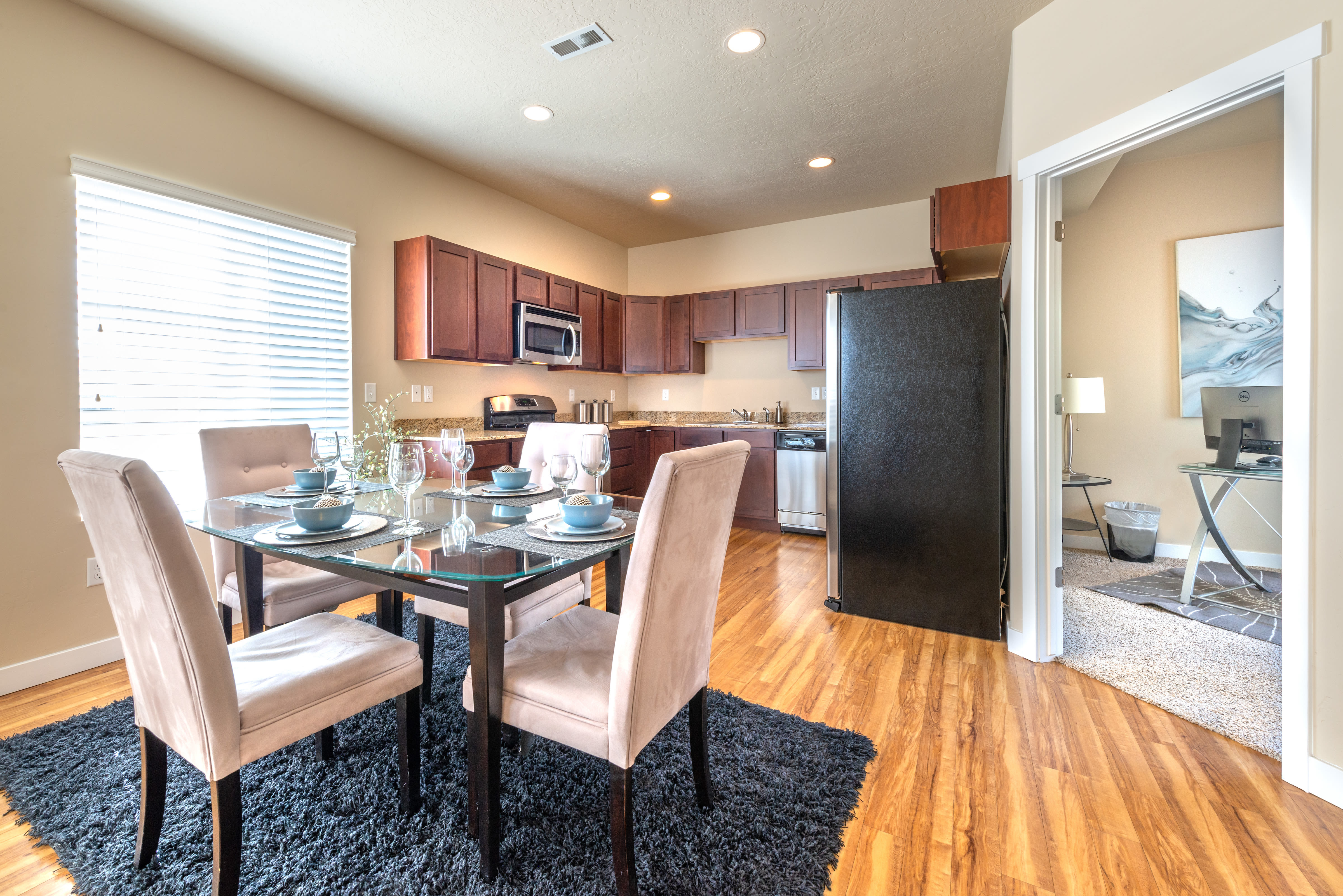 Dining table in model home at Olympus at the District in South Jordan, Utah