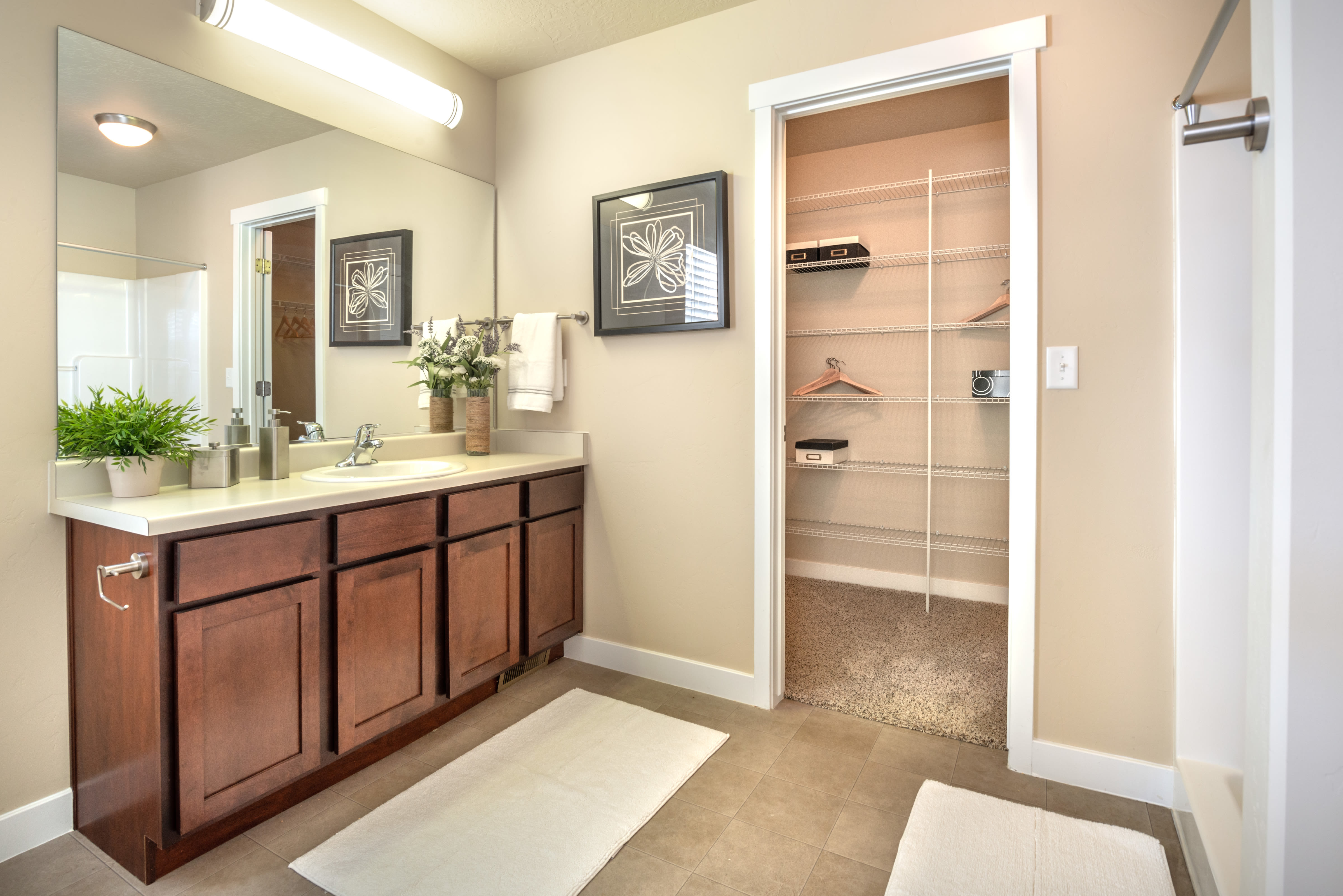 Bathroom and walk-in closet of Olympus at the District in South Jordan, Utah