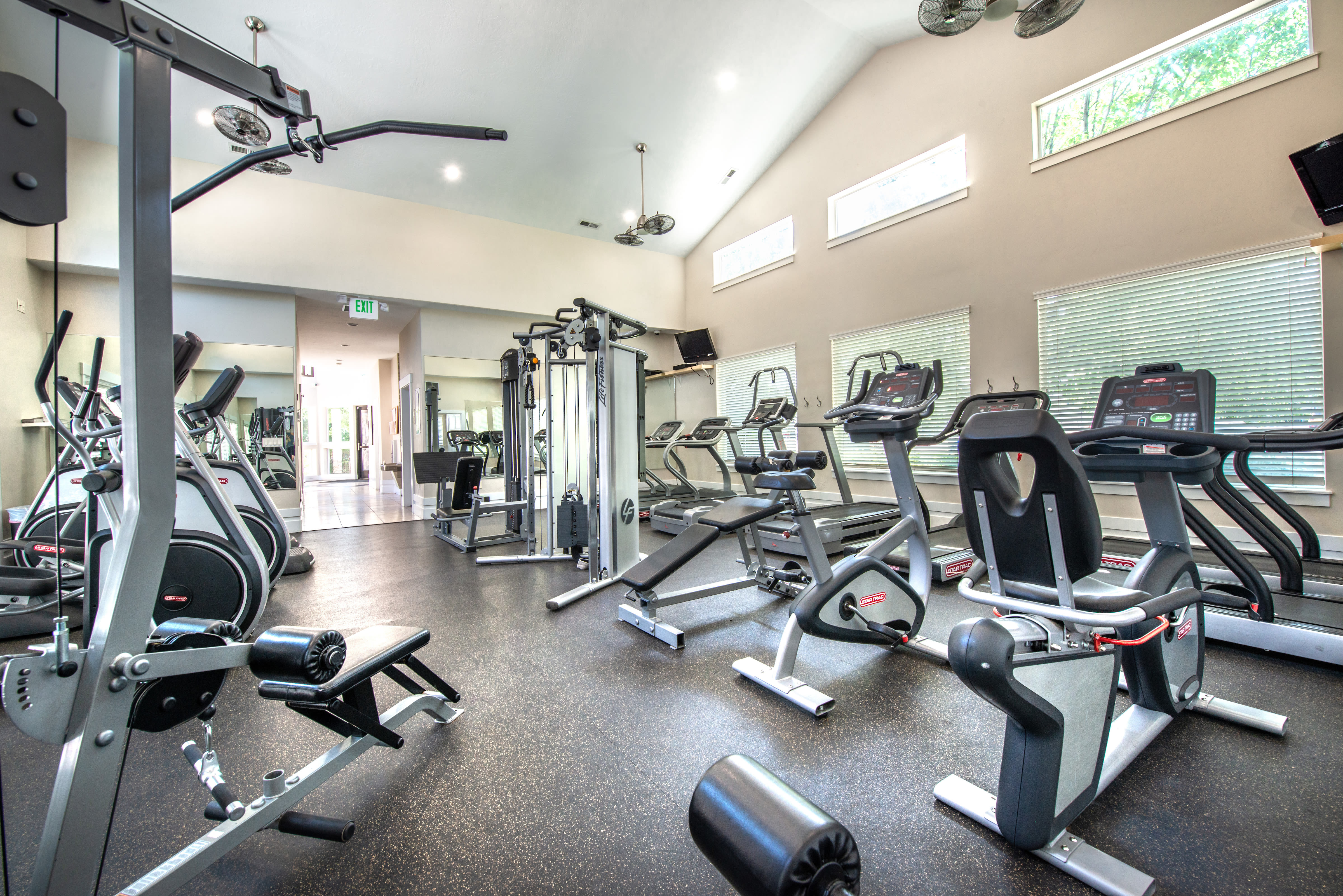 Treadmills and other exercise equipment in fitness center at Olympus at the District in South Jordan, Utah