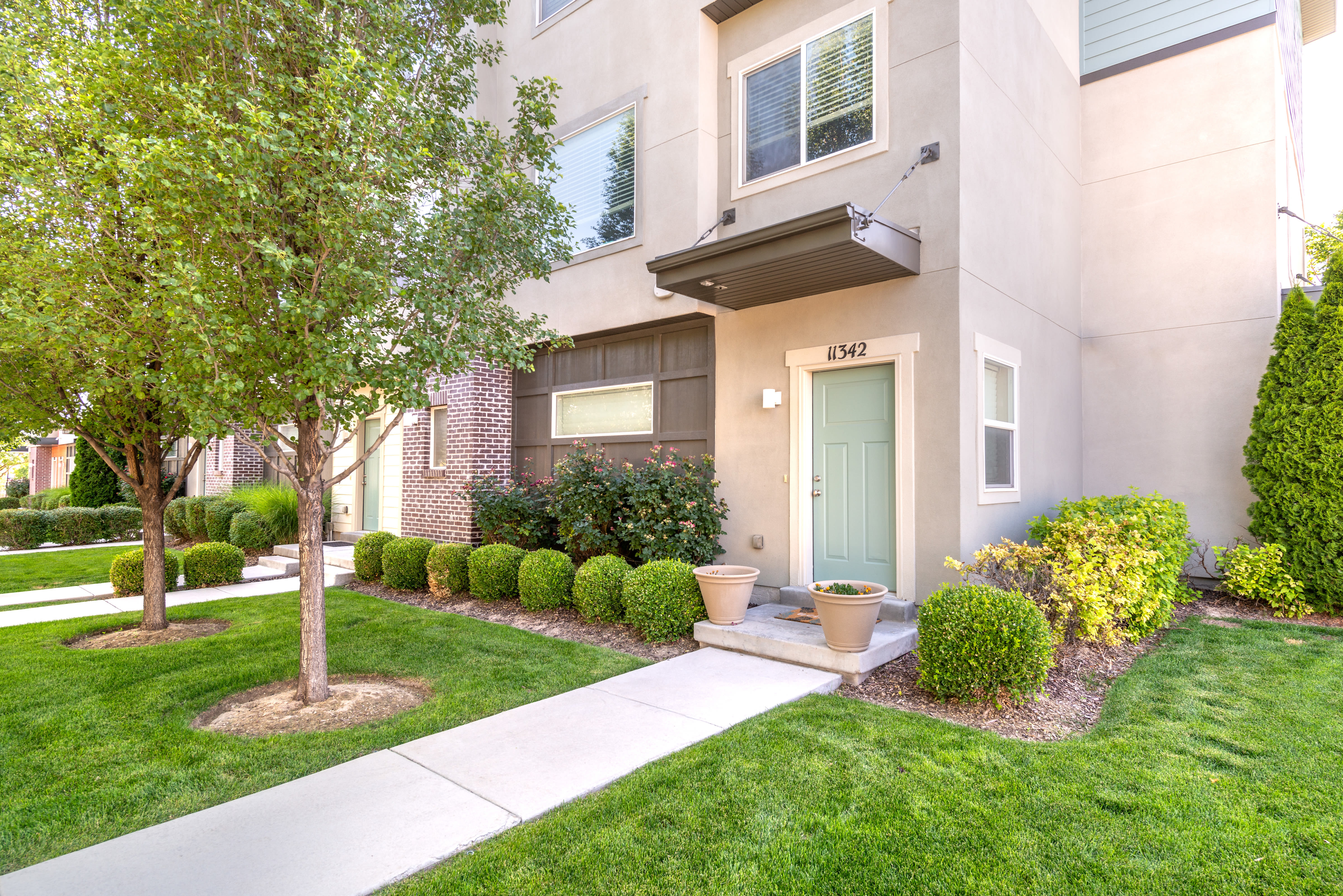 Resident entrance to model home at Olympus at the District in South Jordan, Utah